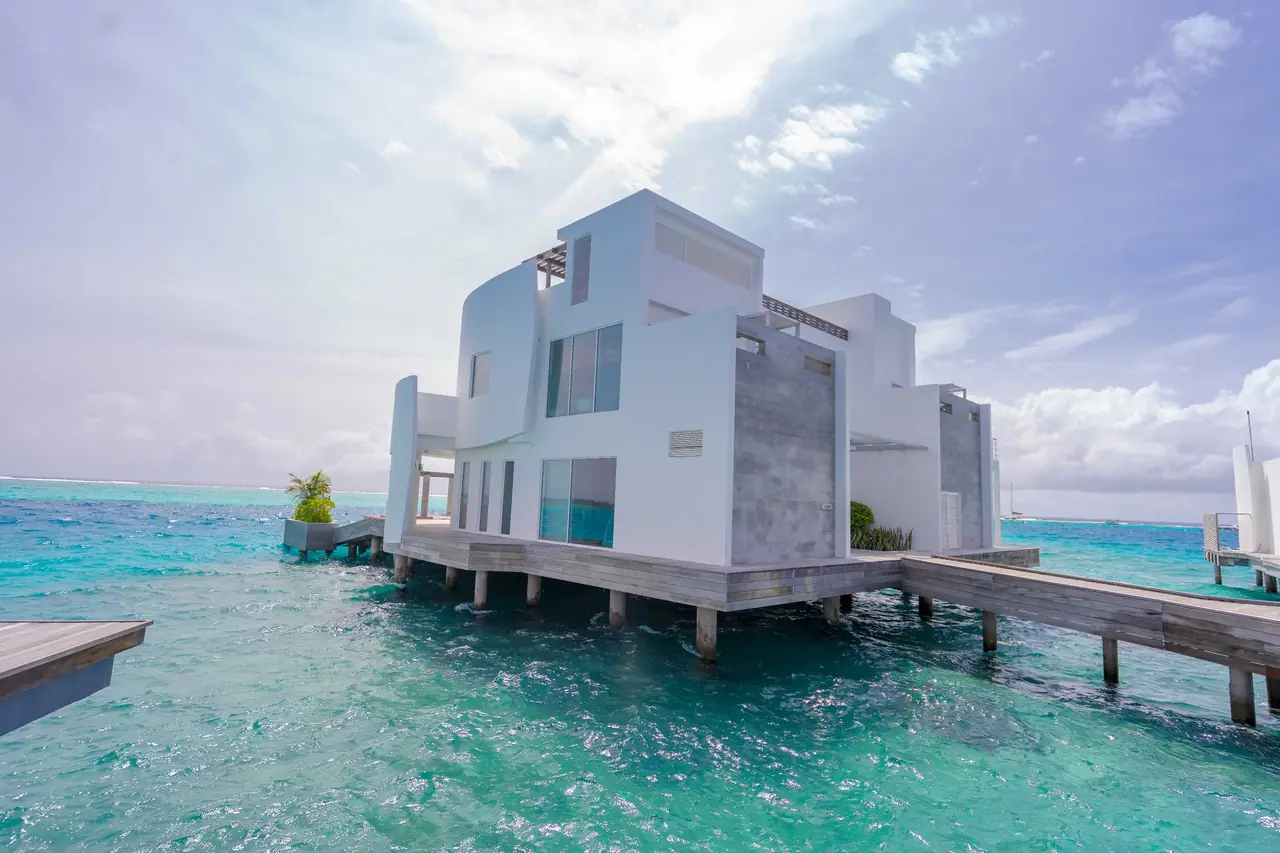 Bali vs Maldives for a UAE Family Holiday — tropical overwater villa turquoise
