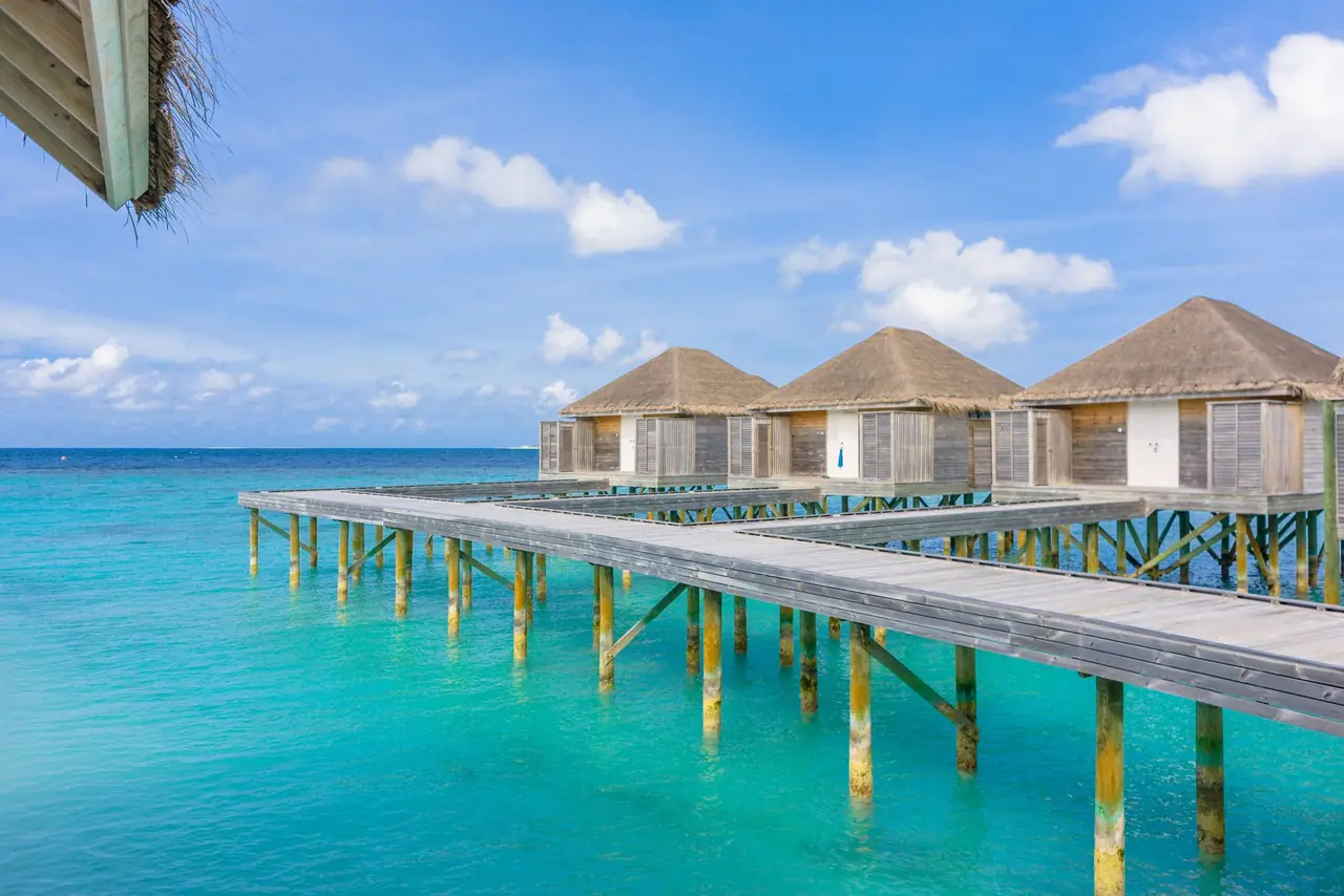 Bali vs Maldives for a UAE Family Holiday — tropical overwater villa turquoise